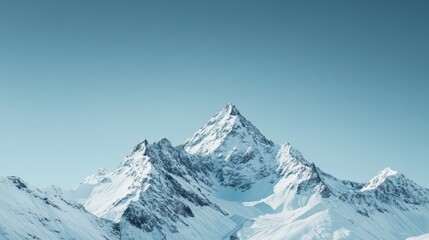 Fototapeta premium Majestic snowy peaks rise against a clear blue sky, capturing the awe and grandeur of untouched natural landscapes.
