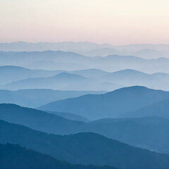 Obraz premium Layered Mountainscape: Capturing the majestic allure of rolling mountain ranges fading into a tranquil haze, showcasing the sheer scale and natural elegance of the great outdoors. 