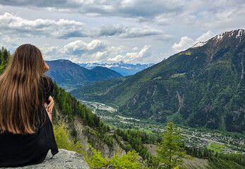 Naklejka premium Girl in the Alps