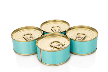 Four metal cans of tuna, close-up, isolated on a white background.