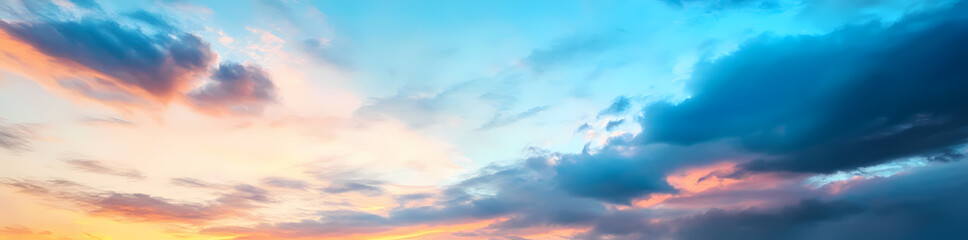 Obraz premium Panoramic sky with beautiful clouds at sunset, featuring blue and orange colors