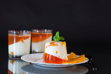 Bright jelly with pieces of peaches and butter cream