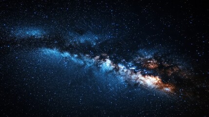 Obraz premium The Milky Way stretches across a tranquil night sky, its stars forming a luminous band of cosmic wonder.