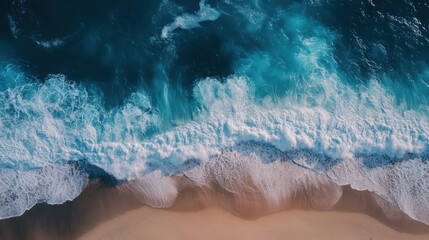 Fototapeta premium Ocean waves crashing on a sandy beach.