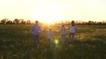 Family mother father child kid daughter girl Walk Sunset, Together woman man child Fields, Cherishing Moments teamwork, Golden Hour Stroll holding hands, Holding Hands Under Sun family, Peaceful