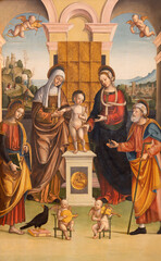 Pavia - The renaissance paintng of Jesus child with Madonna, st. Anna, Joachim,  St. John in church...