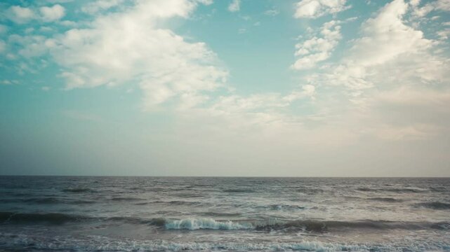 Beach waves on an empty beach with soft daylight