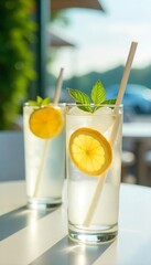 Refreshing Lemon and Mint Summer Drinks in Sunlight