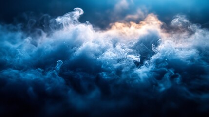 Obraz premium In a tranquil moment, delicate clouds of blue and gray intertwine, revealing hints of golden light. This captivating fog adds an enchanting layer to the quiet landscape at dawn