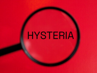 Hysteria text through magnifying glass red background