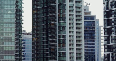 Obraz premium Glass skyscrapers in the office center of a modern city. Overview of house facades