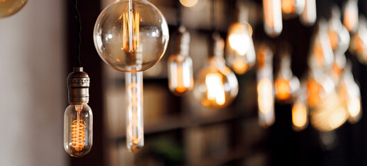 Warm vintage edison bulbs illuminating cozy indoor space with soft glow