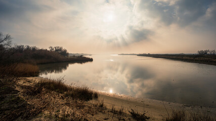 Obraz premium the river Po inside its Veneto side Delta during a winter season, Rovigo, Italy