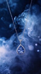 An exquisite teardrop blue gemstone pendant hangs gracefully on a delicate silver chain, surrounded by swirling wisps of ethereal smoke. The subtle glow highlights its brilliance