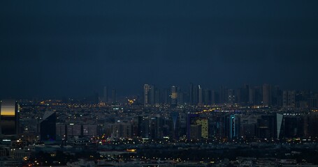 Big city at night, panoramic view. Light in the houses windows