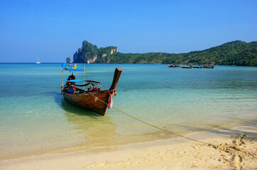 Longtail boat anchored at Ao Loh Dalum beach on Phi Phi Don Island, Krabi Province, Thailand