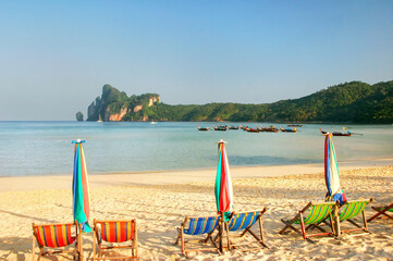 Umrellas and sunchairs at Ao Loh Dalum beach on Phi Phi Don Island, Krabi Province, Thailand