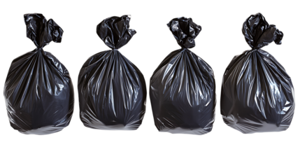 A collection of four large black plastic garbage bags tied at the top, durable and strong for household waste disposal. Isolated on a white background, 