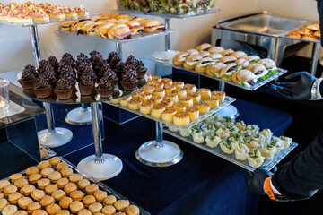 catering table with food, snacks and desserts