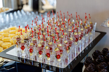 catering table with food, snacks and desserts