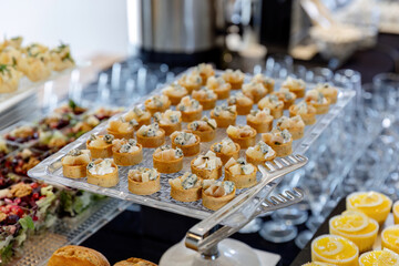 catering table with food, snacks and desserts