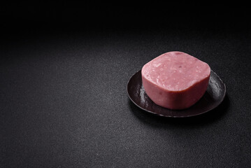 Delicious canned pink ham with salt, spices and herbs
