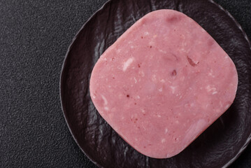 Delicious canned pink ham with salt, spices and herbs