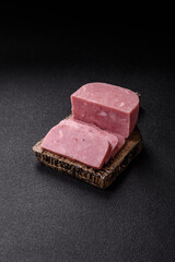 Delicious canned pink ham with salt, spices and herbs