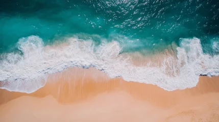 Fotobehang Aerial View of Turquoise Ocean Waves Crashing on Sandy Beach © Vader Stocker