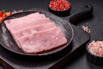 Delicious canned pink ham with salt, spices and herbs