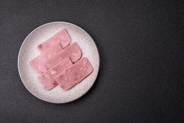Delicious canned pink ham with salt, spices and herbs