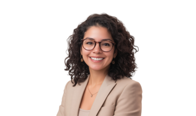Portrait of a Confident Professional Woman: A sophisticated and accomplished young woman with a warm smile and kind eyes, wearing stylish glasses, embodies modern professionalism and approachability.