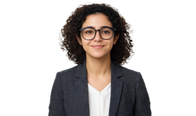 Confident Woman Portrait: A striking portrait of a confident young woman with curly hair and glasses, dressed in a professional suit, radiating approachability and intelligence.