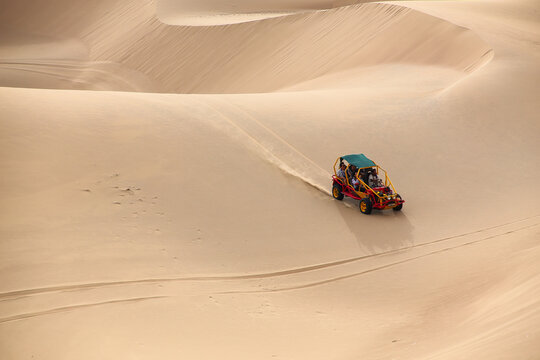 Dune buggy in a desert near Huacachina, Ica region, Peru.