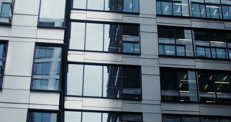Facade of an office building with large panoramic windows. Business Quarter, no people on video....