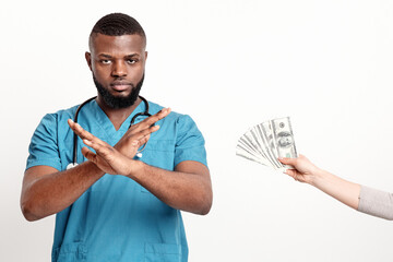 African American doctor refusing to take money from woman over white background. Corruption in...