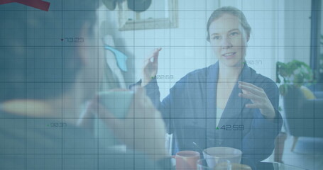 Image of financial data processing over diverse colleagues discussing work in office