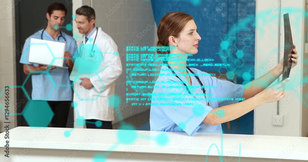 Poster image of data processing over caucasian doctors talking and checking xray