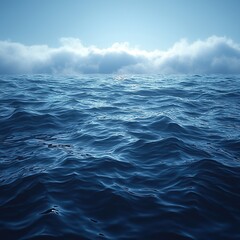 Calm ocean waves reflect sunlight under a clear blue sky during early morning hours