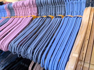Colorful collection of hangers neatly arranged in a retail store display