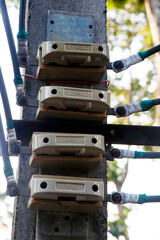 Old ceramic electrical fuses with connecting wires - close up view