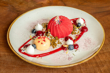 Gourmet dessert with berries and artistic plating
