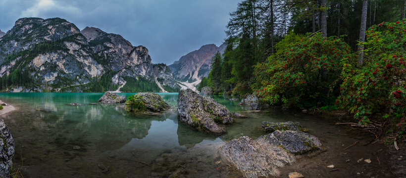 Lago di Braies Pragser Wildsee lake mountain lake with stones rocks in the foreground