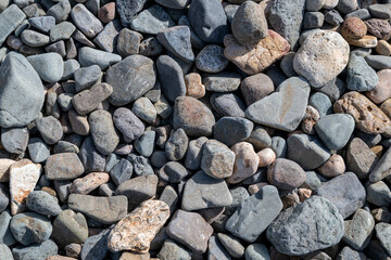 Close-up of smooth gray pebbles on a beach