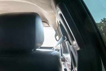 Interior View of Car Showing Seat Belt and Headrest Detail