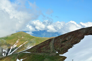 mountain landscape with blue sky and clouds