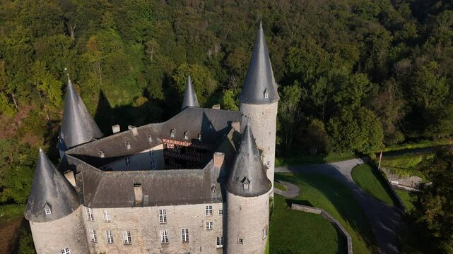 Discovering the enchanting Veves Castle in Belgium surrounded by lush greenery