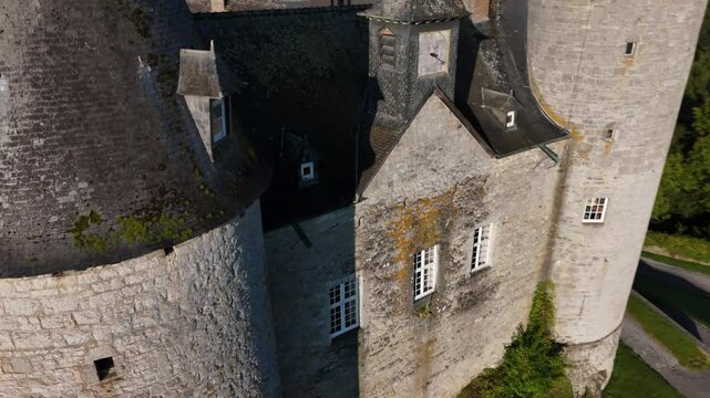 Explore Veves Castle in Belgium during a sunny afternoon stroll through history