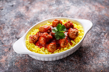 Chicken meatballs with tomato sauce.