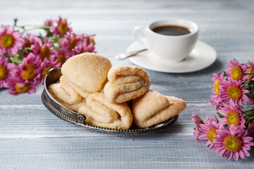 Homemade nut shaped russian soviet cookies and wafer rolls with pastry cream.